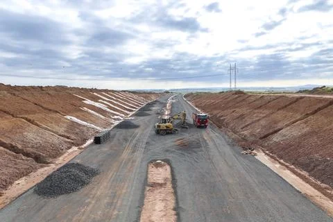 Road construction work with excavator and truck on Dekov D6 Stock Photos