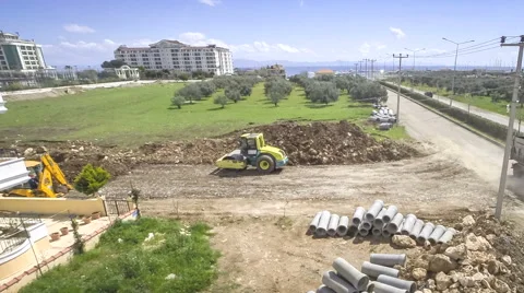 Road construction work. High angle at yellow roller and bulldoze Stock Footage 49626987