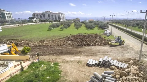 Road construction work. High angle at dumper and road roller action Stock Footage 49630218