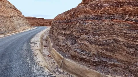 Road construction work in progress on a winding mountain pass in the morocc.. Stock Footage 334036324