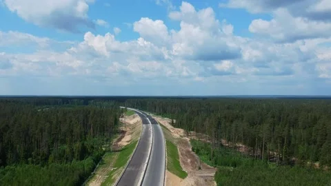 Road construction work. Shooting from the air on a drone road with a new asphalt Stock Footage 139968307