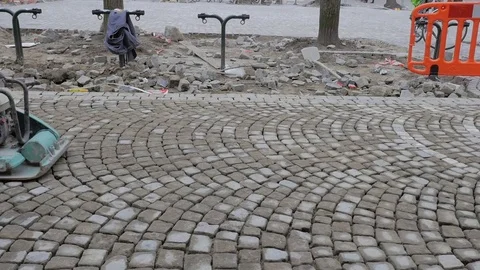 Road Construction Worker Leveling Cobblestones Stock Footage 73070496