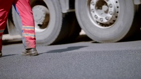Road Construction Worker Taking Steps Walking On An Asphalt Road Stock Footage 142005092