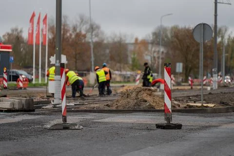 Road construction workers wearing reflective vests Stock Photos