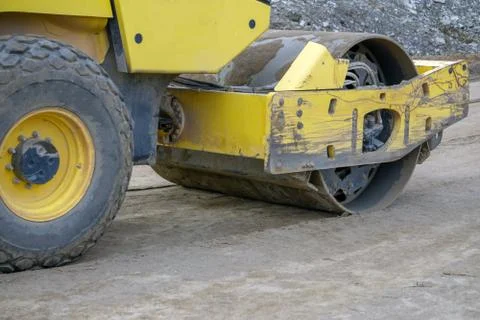Road construction works with roller compactor machine and asphalt finisher . Stock Photos