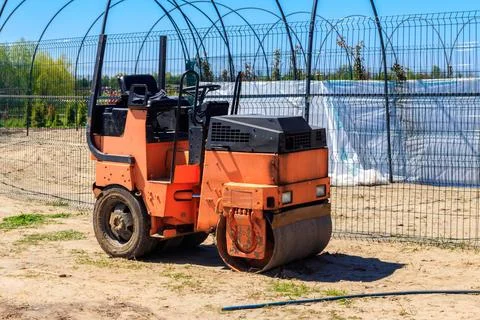 Road construction works with roller compactor machine Stock Photos