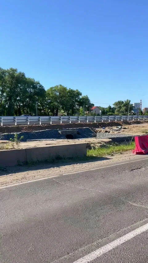 Road construction zone with plastic barriers on asphalt highway. Protective Stock Footage 339434178
