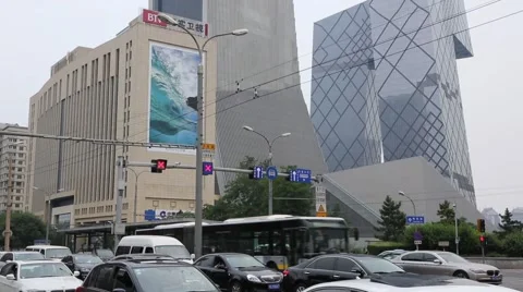Road crossing with a view of the headquarters CCTV, Beijing Stock Footage 52039683