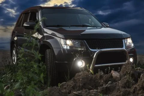 Off-road crossover at night Stock Photos