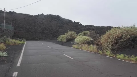 Road cut by lava Stock Footage 255484860
