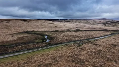 Road cutting through bleak Dartmoor in winter Stock Footage 342422959