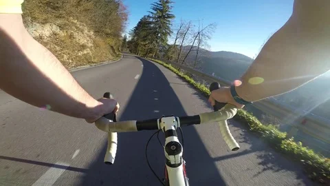 Road cycler going fast on asphalt road Stock Footage 82315167