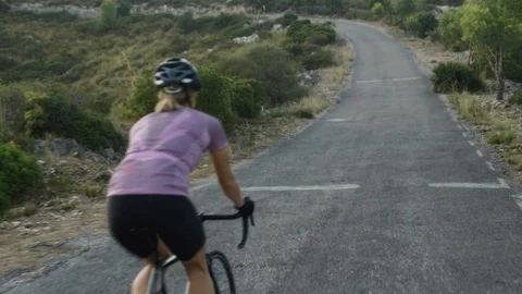 Road cycling in mountains Stock Footage 128761995