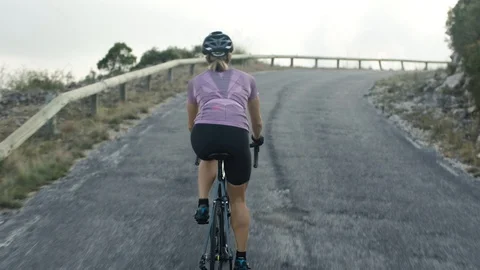 Road cycling in mountains Stock Footage 128762004