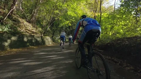Road cyclists doing a speed descent Stock Footage 157187951
