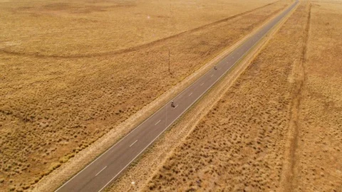 Road with cyclists on it in the middle of nowhere Stock Footage 91687049