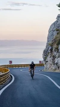Road cyclists  in mountains. Stock Photos