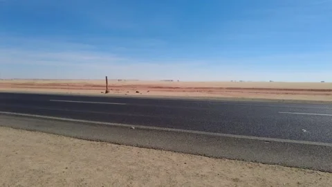 Road in the desert with paper flying in the wind. Egypt NOV16 2022 Stock Footage 307057038