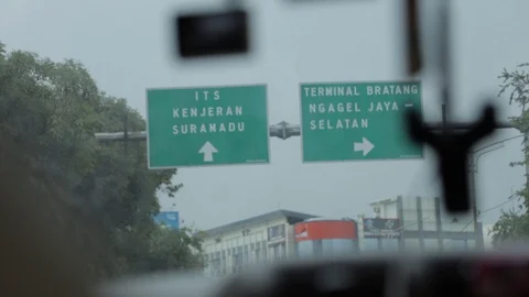 Road Direction Sign, a View From a Car, Surabaya, East Java, Indonesia Stock Footage 129366430