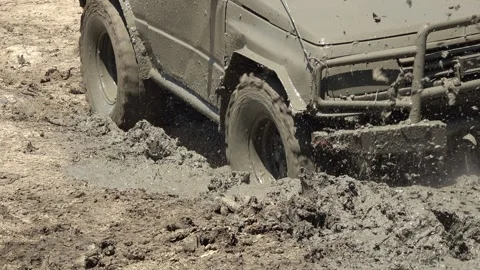 Off-road driving on muddy terrain 스톡 동영상 335222958