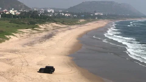 Off road driving an SUV IN beach Stock Footage 147071492