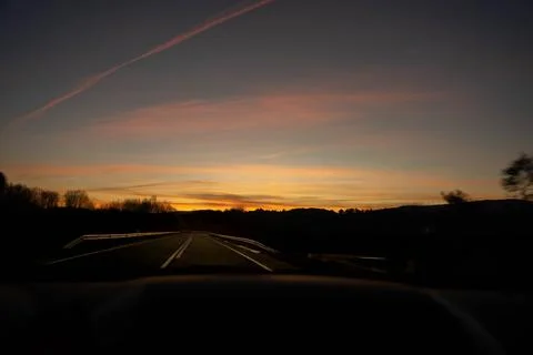 Road at dusk Stock Photos
