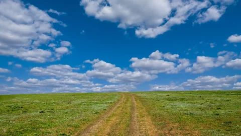 Road in a field time lapse scene Stock Footage 279178910