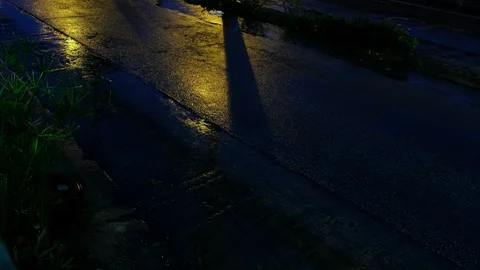 Road floods due to the rain at night time with reflection of street light. Stock Footage 128408328