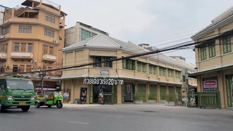 Road in front of the noodle shop with a message meaning "Boat noodles 20 baht" Stock Footage 274829693