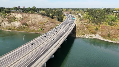 A road full of vehicles crosses a river Stock Footage 317474138