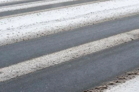 Road getting covered in snow Stock Photos