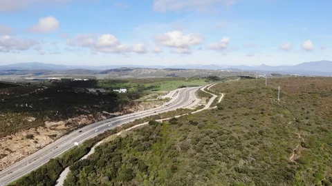 Road to Gibraltar highway, top view from drone. Cars go on highway Stock Footage 101637673