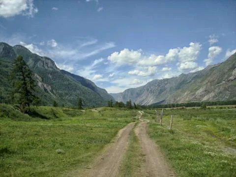 The road going to the mountains Stock Photos