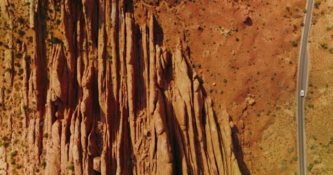 Road going parallel to the beautiful rocks in Arches National Park. Video stock 213342521