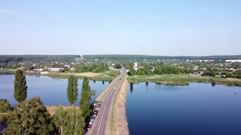 Road going through big lake at countryside. Stock Footage 247250543