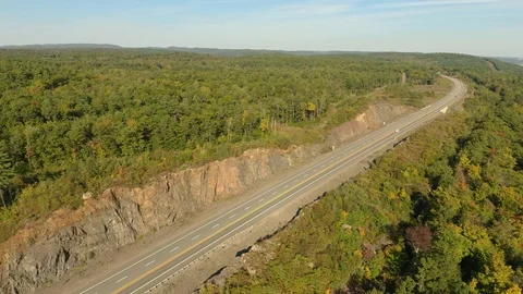 Road going through cliffs that were previously set to explode to let traffic Stock Footage 121534667