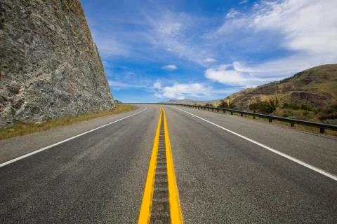 Road going through the mountains Stock Photos