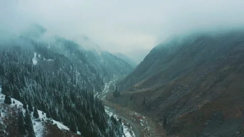 The road to the gorge. Snowing Stock Footage 249496740