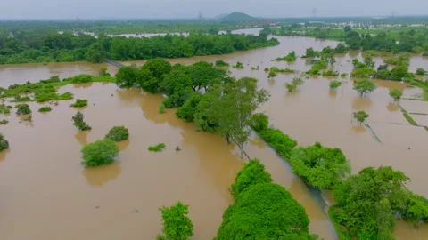 The road got blocked due to rising river water due to flood during rainy seas Stock Footage 283263189