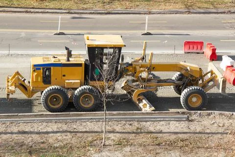 Road grader machine. Two-blade modern motor tractor Stock Photos