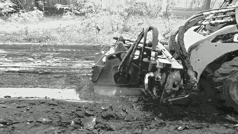 Road Grader Moving On During Handheld Shooting Stock Footage 102657919
