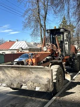 Road Grader Preparing Dirt for Construction Work 写真素材