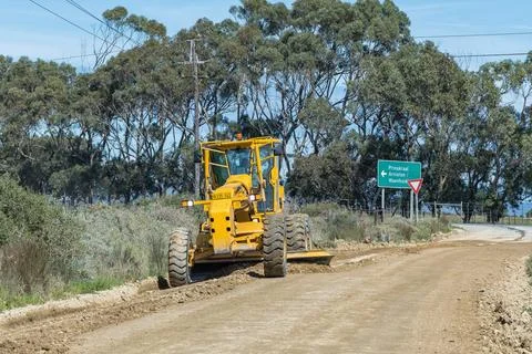 Road grader working on the road between Arniston and Struisbaai Stock Photos