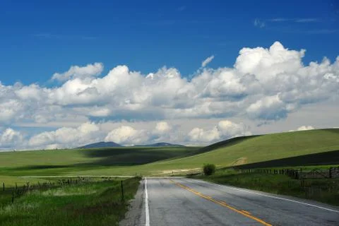 Road in grass hill Stock Photos