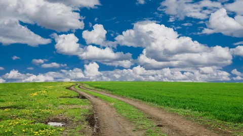 Road in a green fields time lapse scene Video stock 281654521