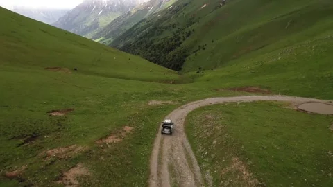 Road in green valley Stock Footage 324437304