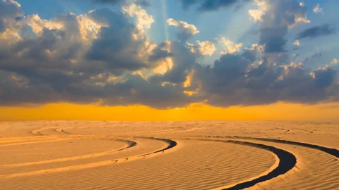 Road in a hot sand desert at the dramatic sunset Stock Footage 154047187