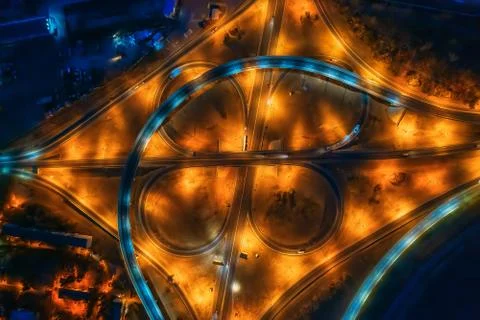 Road intersection, bridges, highways and car traffic in blurred speed motion Stock Photos