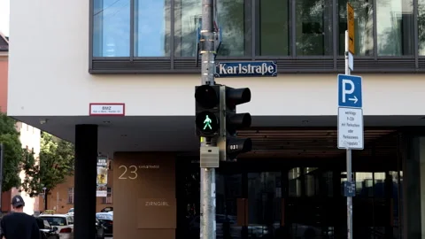 A road intersection with green pedestrian traffic light in the city of Munich. Stock Footage 249260533