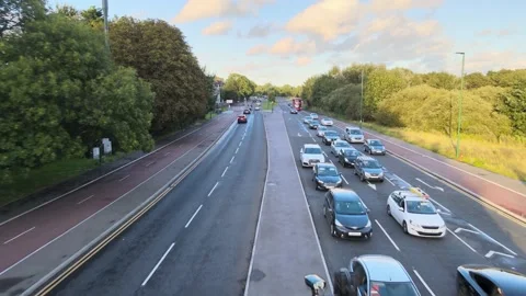 Road intersection on multilane road, cars waiting at traffic lights Stock-Footage 164808892